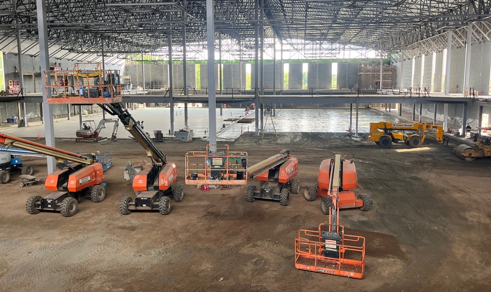 Image shows construction of walking track and gym floor for the City o f Greer's new Sports & Events Center