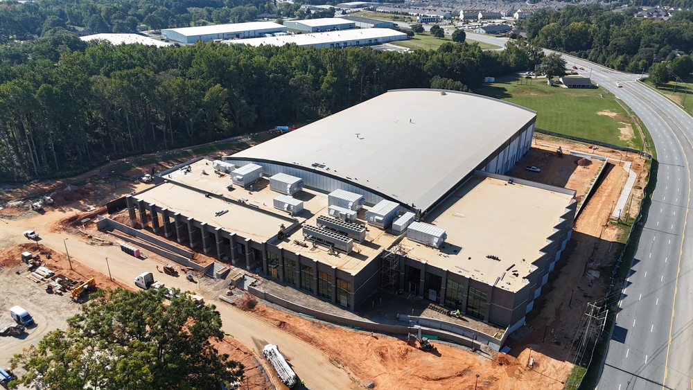 Drone image of the Prisma Health Performance Center showing Highway 14 on the right side and construction status from above
