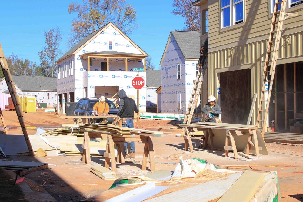 Construction workers on site at a housing development