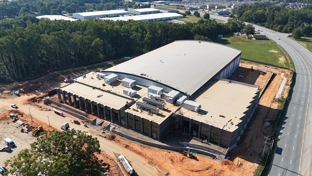 Drone image of the Prisma Health Performance Center showing Highway 14 on the right side and construction status from above