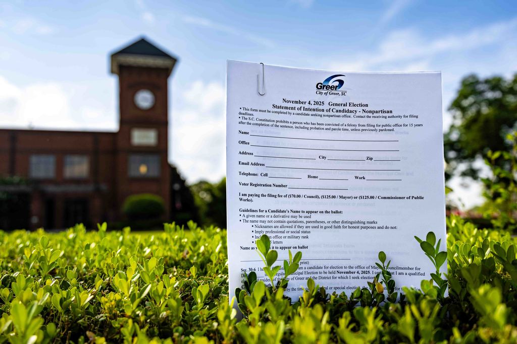 Election Filing Papers in Bush with City Hall in the Background