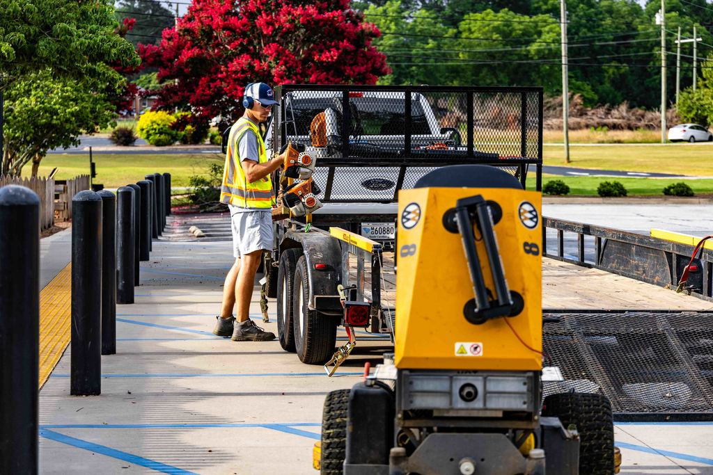 Public Services Worker Puts Equipment Back On Truck