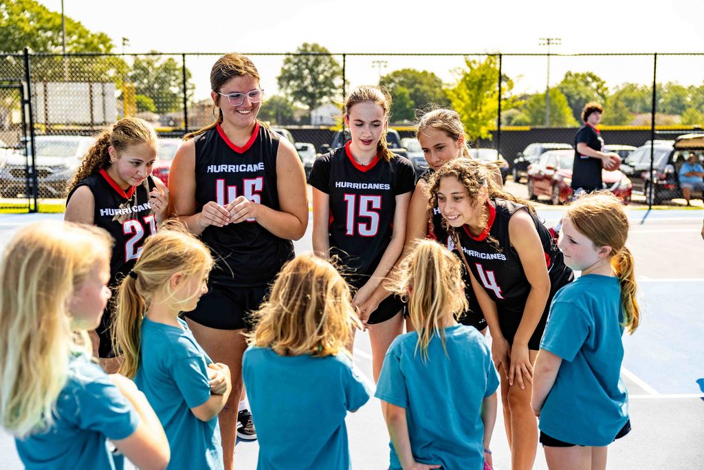 Hurricanes Basketball Team speaks to Girls from Camp Greer at Stevens Courts Ribbon Cutting