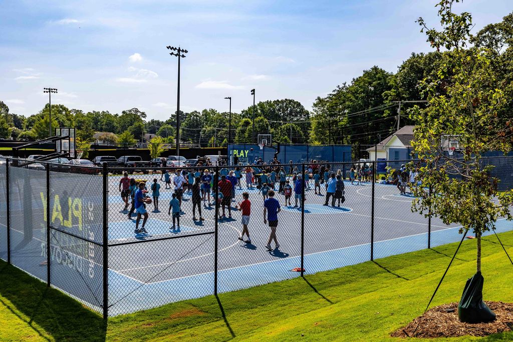 Wide shot of Kids on Basketball Courts for Stevens Courts Ribbon Cutting