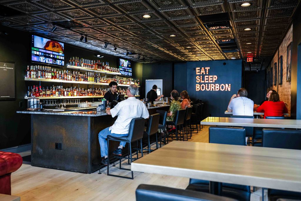 Wide Shot of Neat Bourbon Bar with Customers