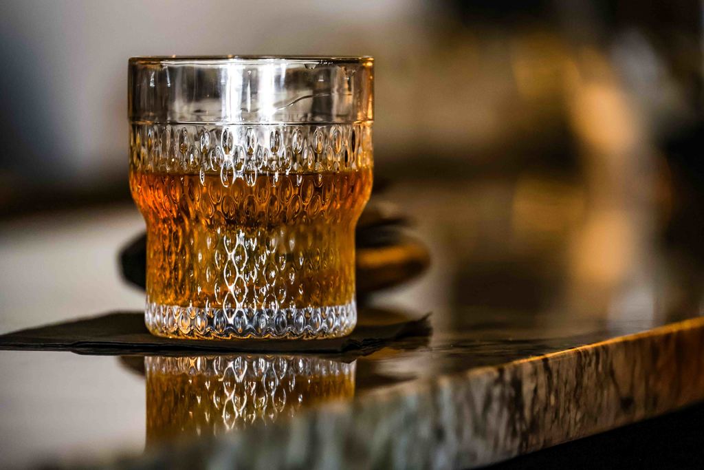Close up of a glass of bourbon