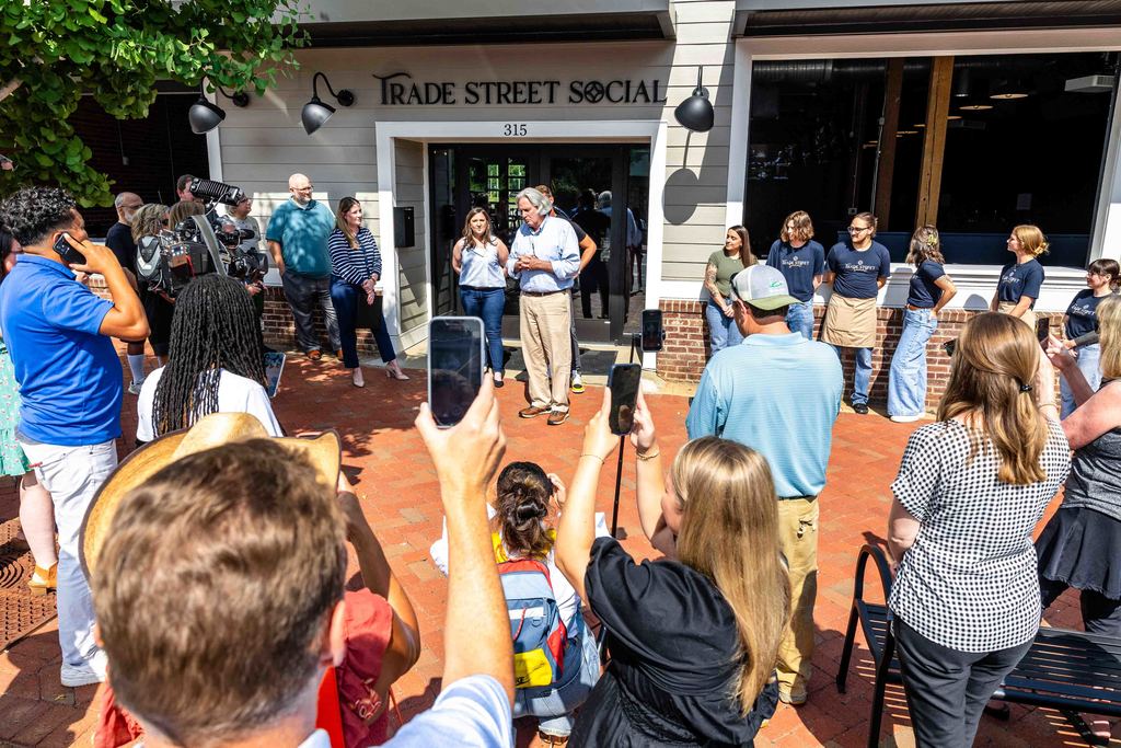Mayor Danner Speaks in front of Crowd during Trade Street Social Ribbon Cutting