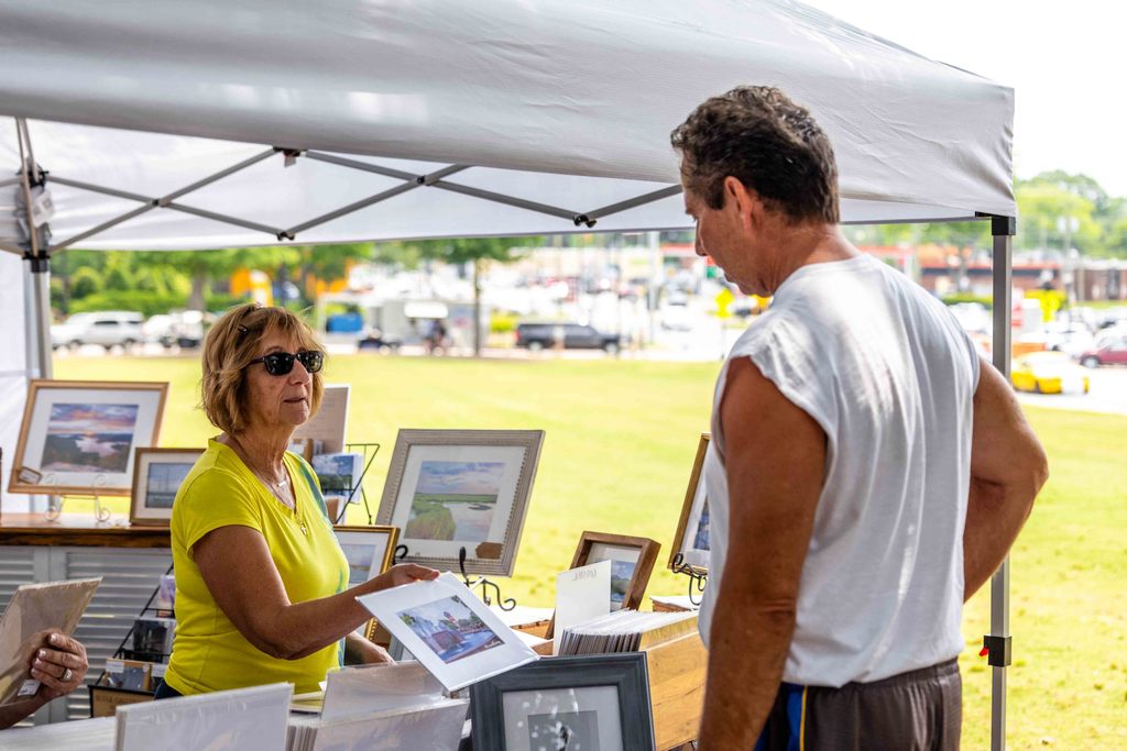 Customer Browsing at Vendor's Tent During Greer Farmers Market