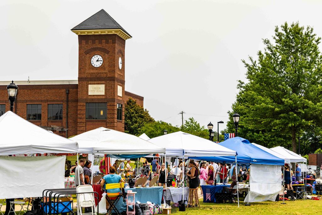 Wide Shot of Vendor Tents with City Hall in the Background During Greer Farmers Market 