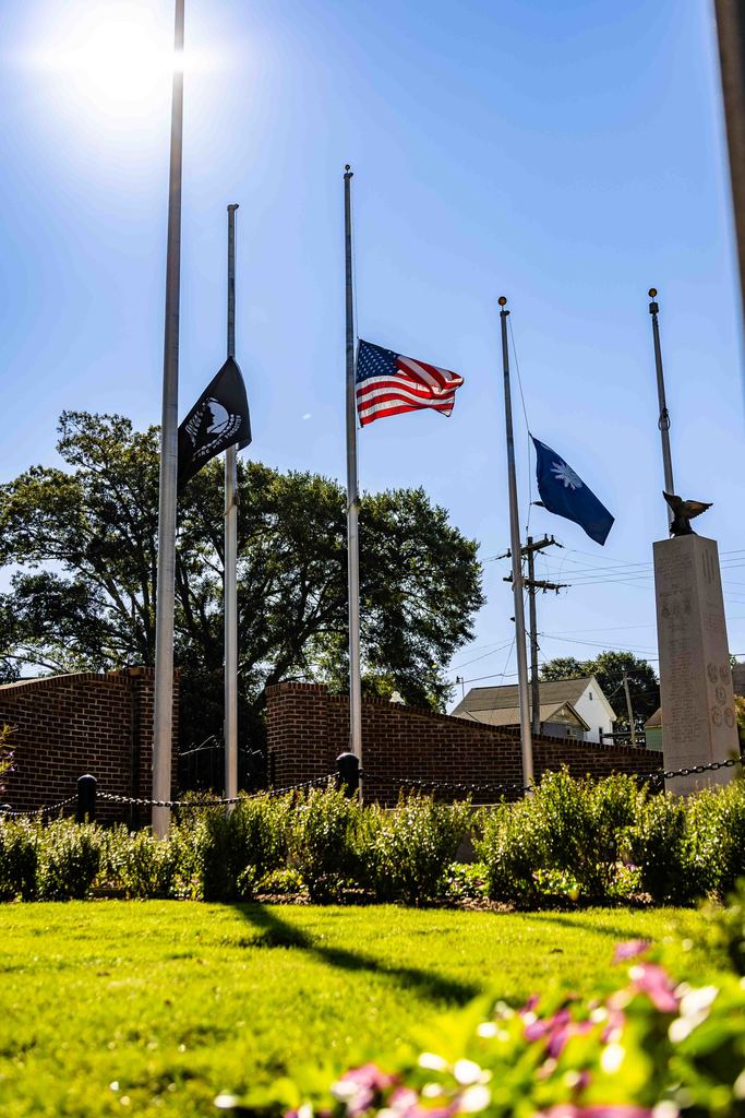 image of flags at half mast