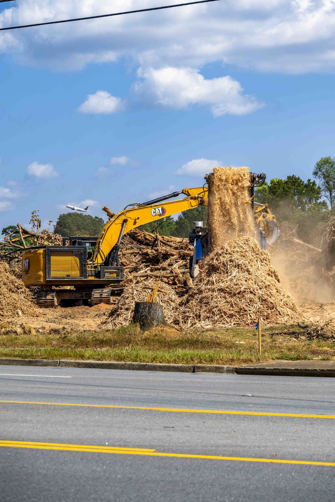 machinery moving dirt at construction site