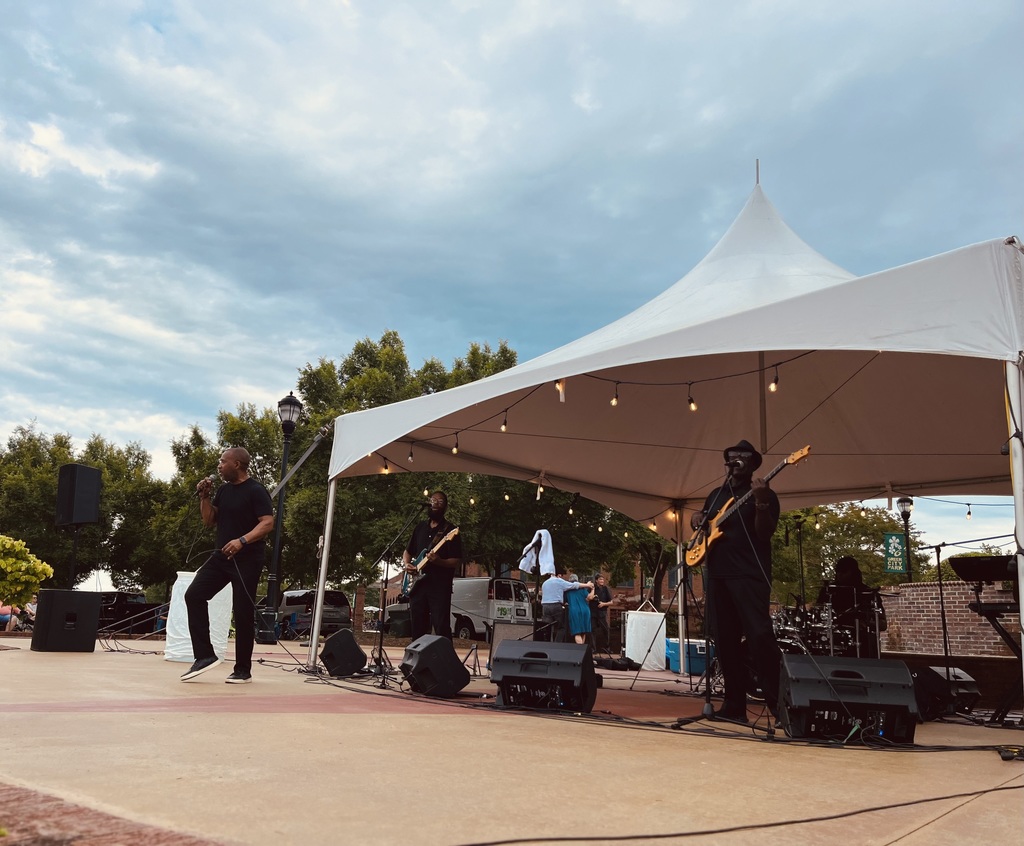 Band on amphitheater stage during Tunes in the Park 