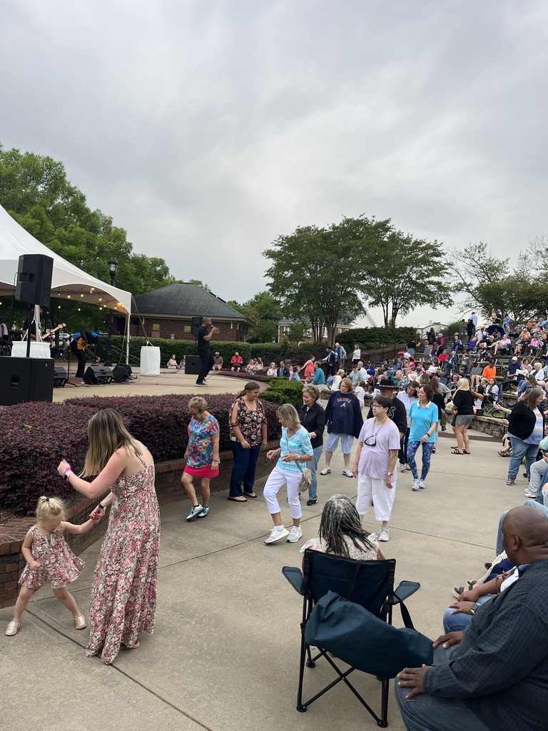 Families dance during Tunes in the Park