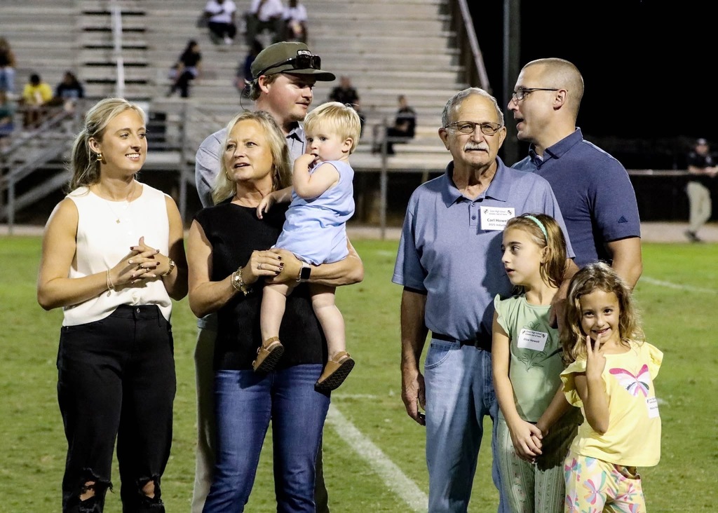 Carl's family standing on field