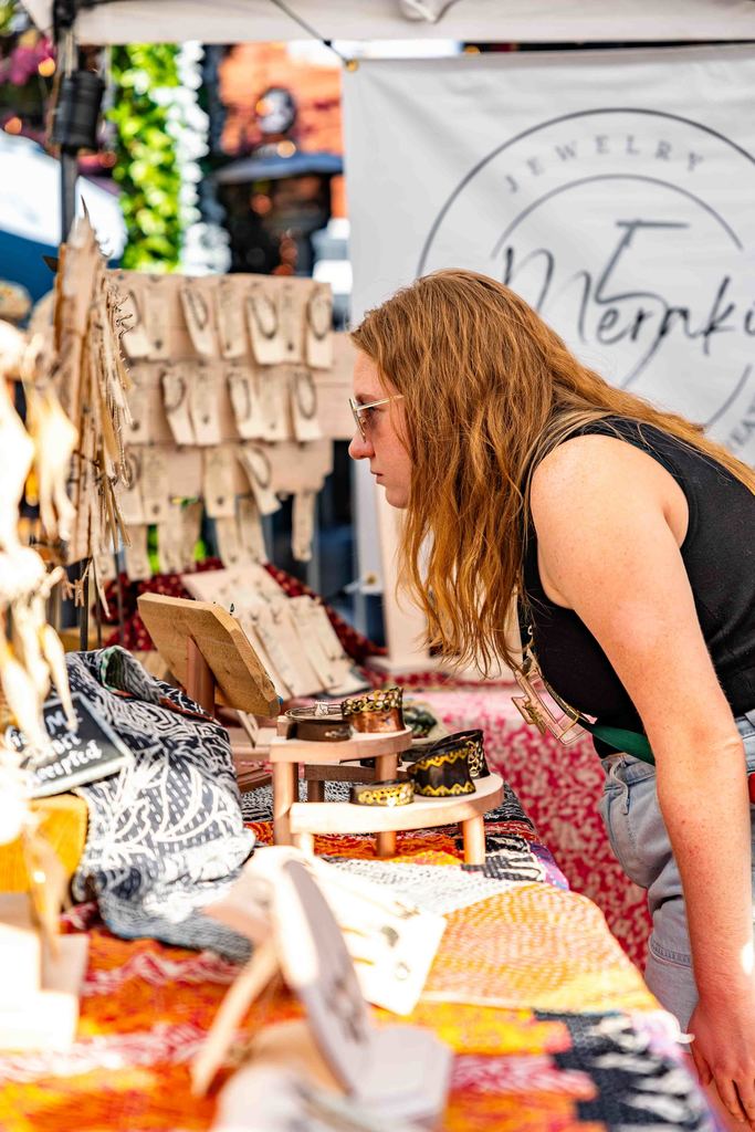 woman shops at a vendor stall