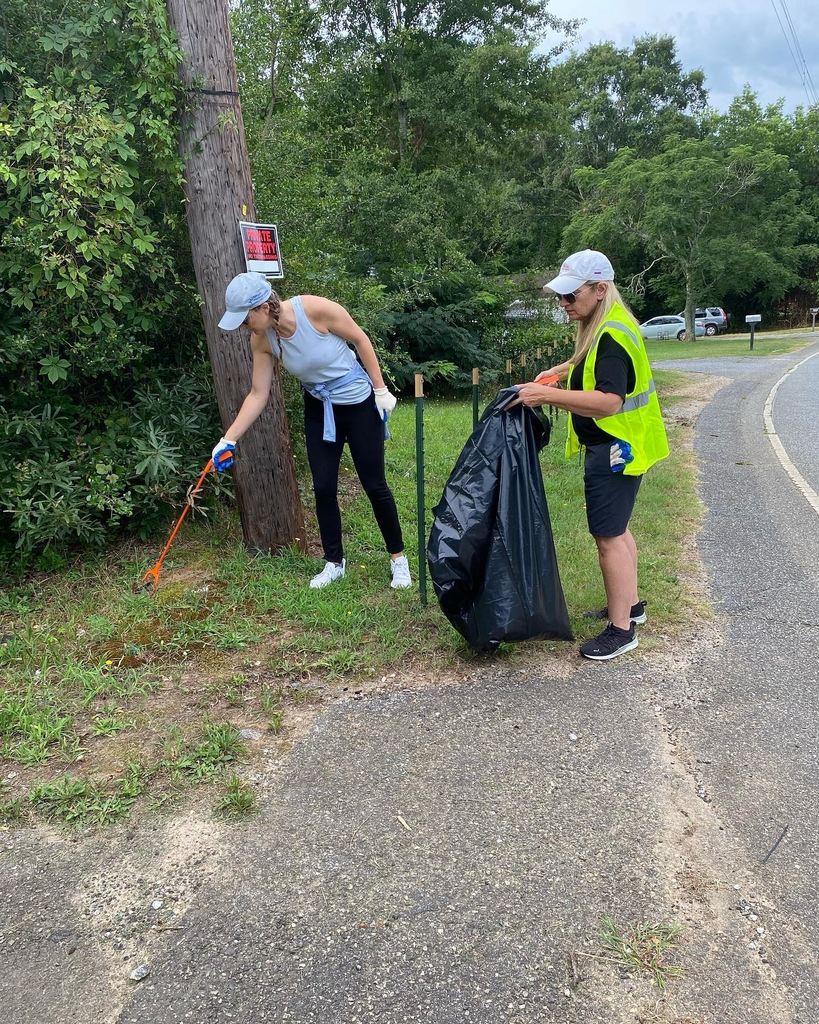 two women cleaning up litter