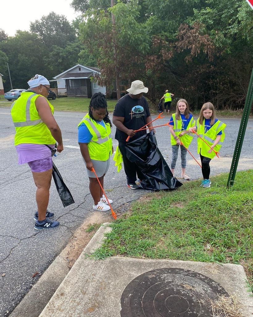 a family cleaning up litter