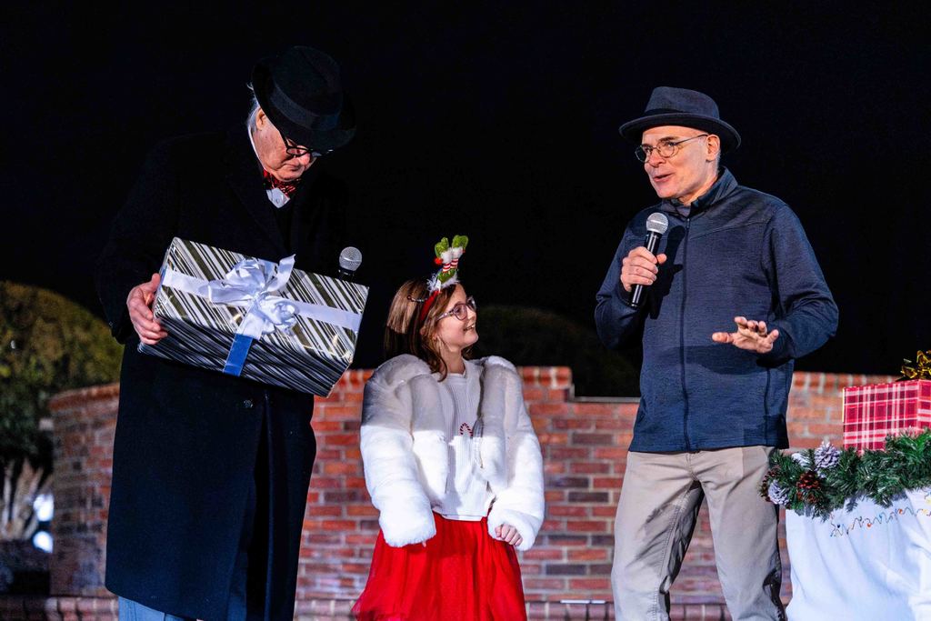 Greer150 Reveal at Greer Christmas Tree Lighting - Mayor Danner, the Mayor's Granddaughter and Museum Director David Lovegrove speak on stage