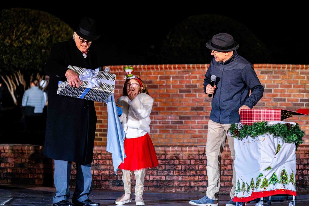 Greer150 Reveal at Greer Christmas Tree Lighting - Mayor Danner, the Mayor's Granddaughter and Museum Director David Lovegrove speak on stage
