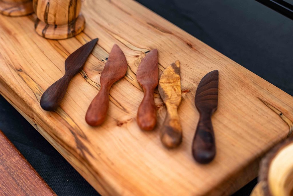 Close up of wooden knives on top of a wooden block 