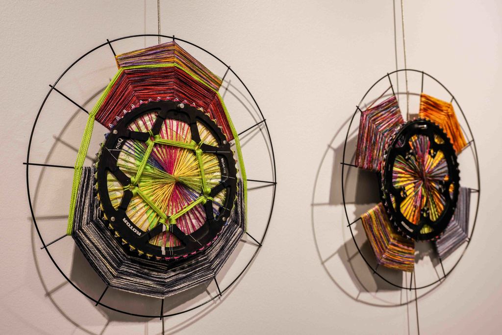 Closeup shots of woven art pieces using various different colors of fabric 