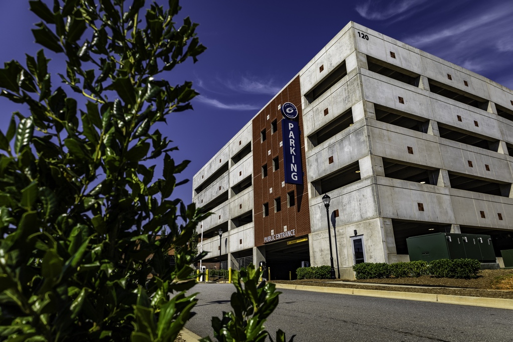 Image shows the exterior of the Jason St. Public Parking Garage