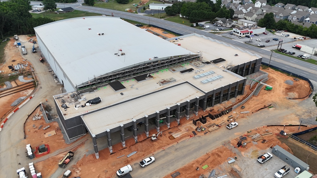 Drone photo shows aerial shot of the City of Greer's Sports & Events Center, Highway 14, and various vehicles along the driveway