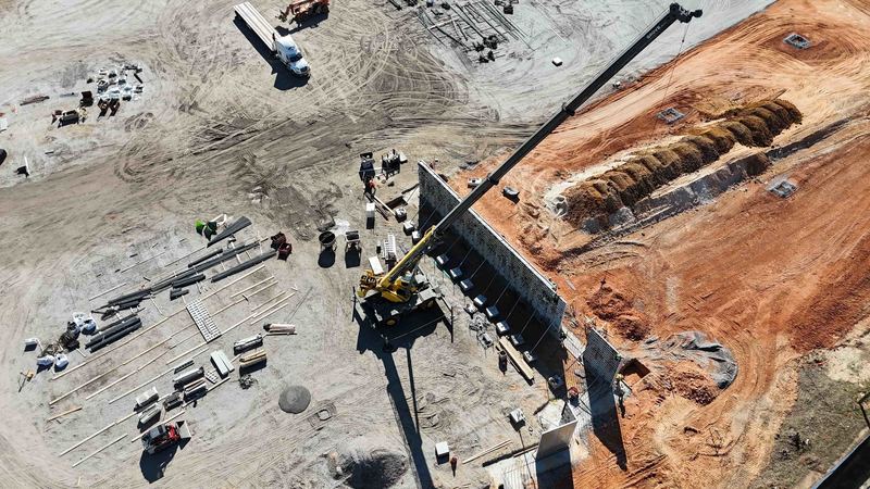 Shot of Crane setting up walls at Sports and Events Center site