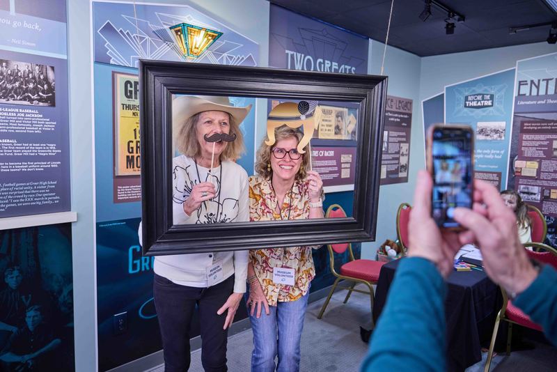 two women taking a photo