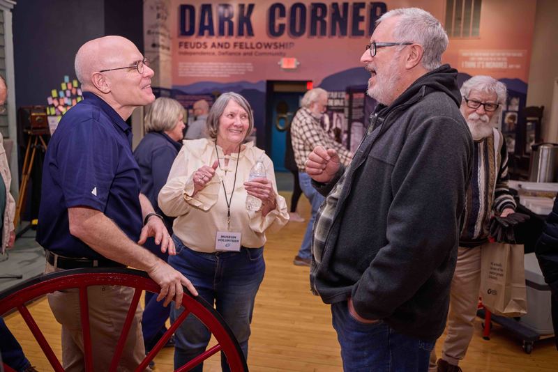 people talking in museum lobby
