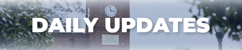 Image with the words Daily Updates and a photo of a snowy Greer City Hall in the Background