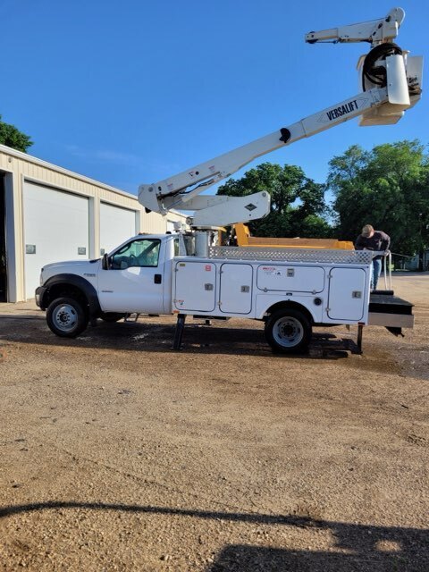 Driver's side view of bucket truck