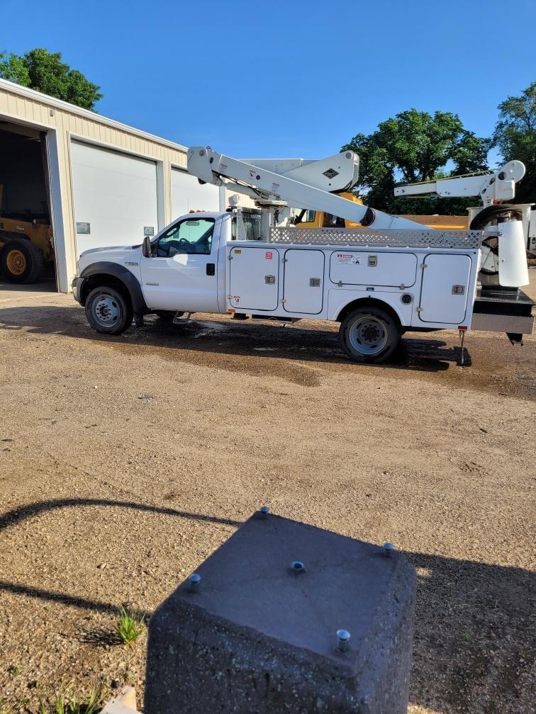Driver's side view of bucket truck