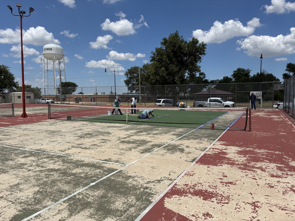 Parks crew repainting tennis courts