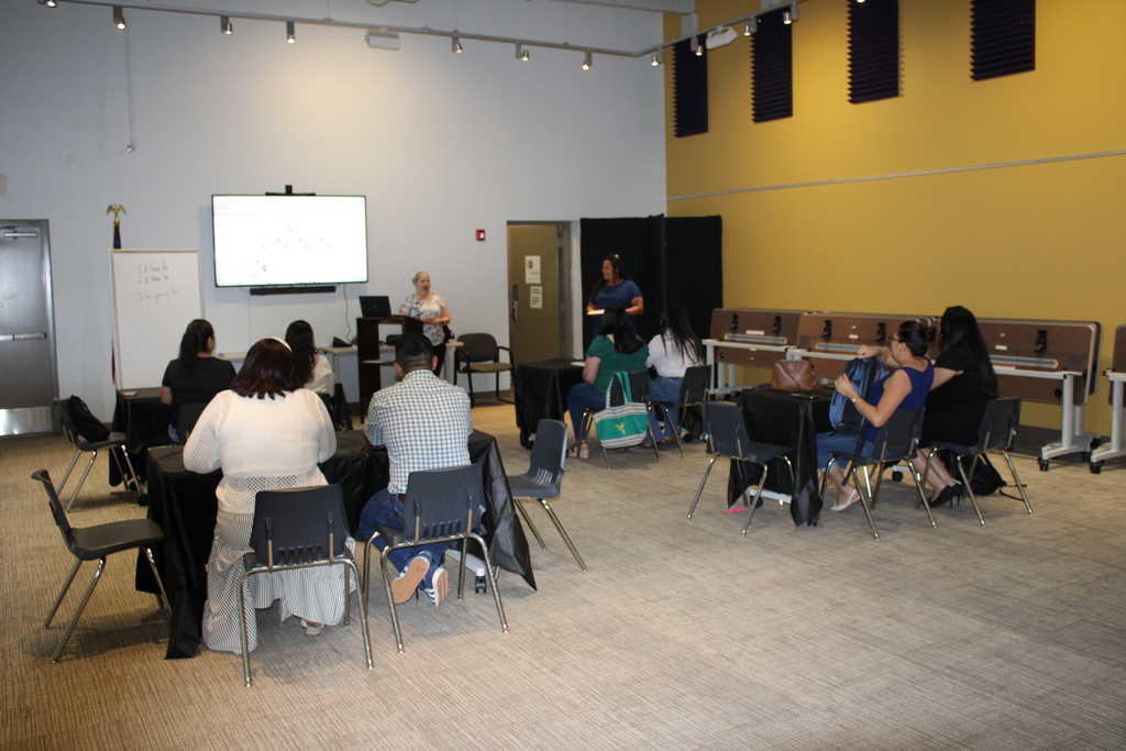 Library Director and Blair Henson address 2026 ESL graduates