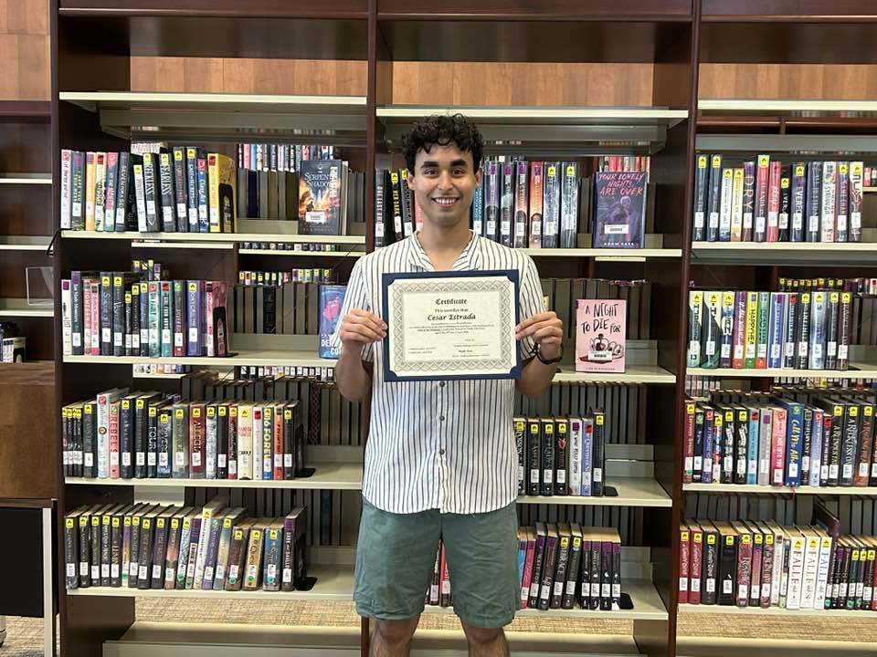 Cesar Estrada with his Oklahoma librarian certification