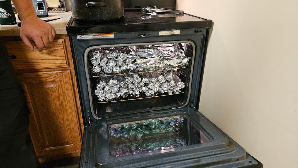 wrapped hot dogs in an oven