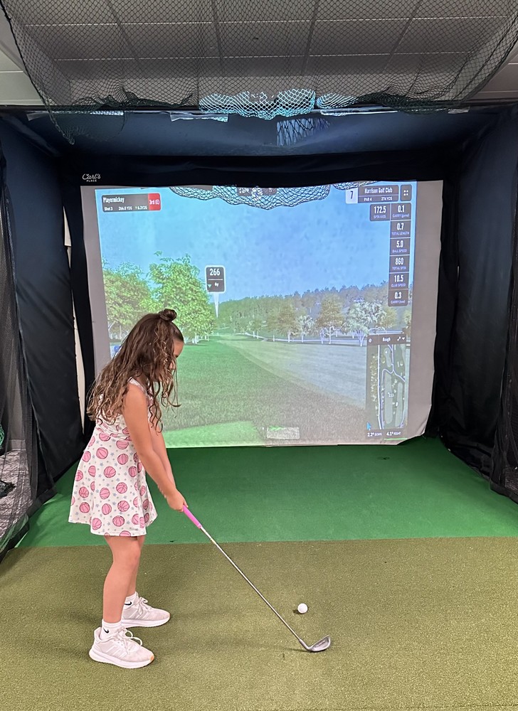 Girl playing golf