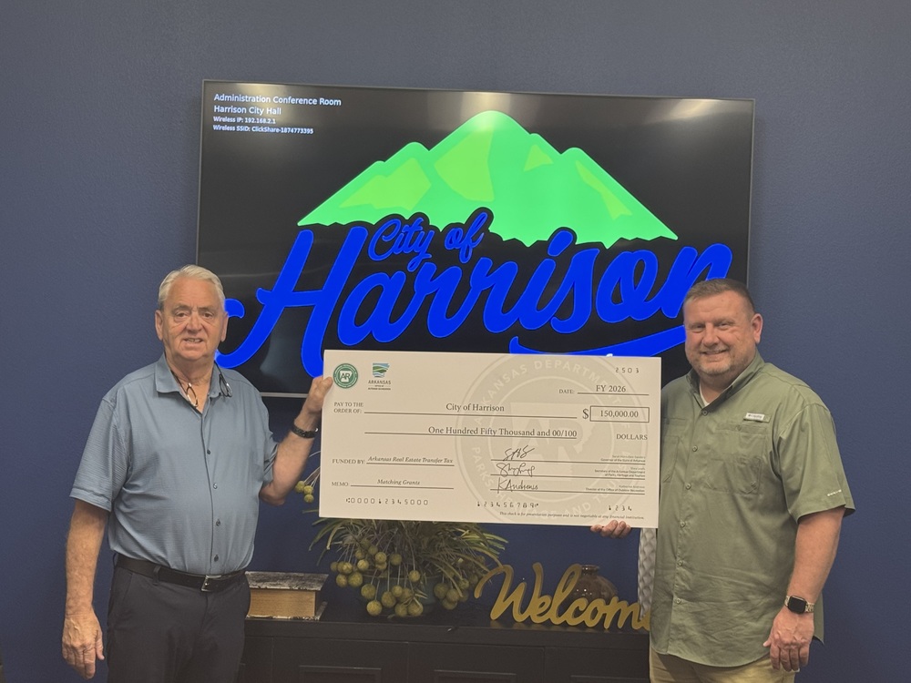 Mayor Jackson and Chuck Eddington accept a check for $150,000.