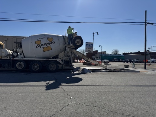Concrete truck pouring concrete