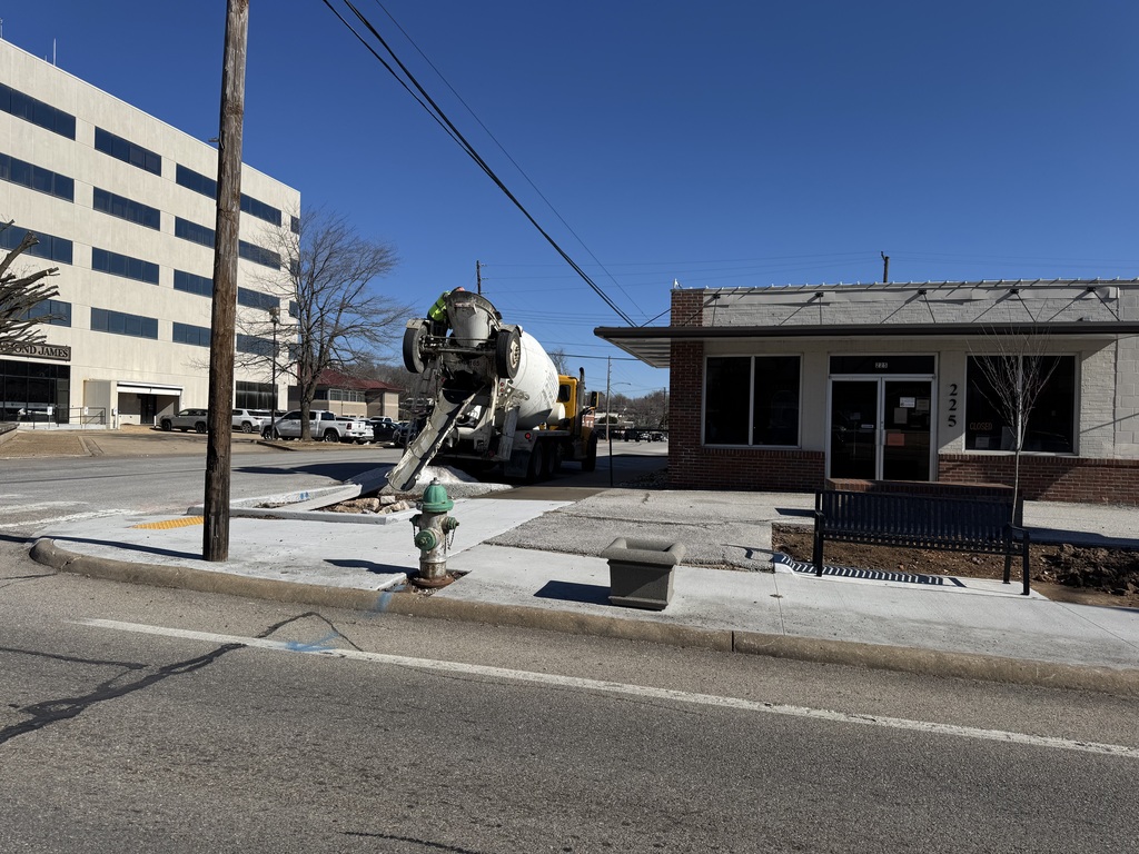 Concrete truck pouring concrete