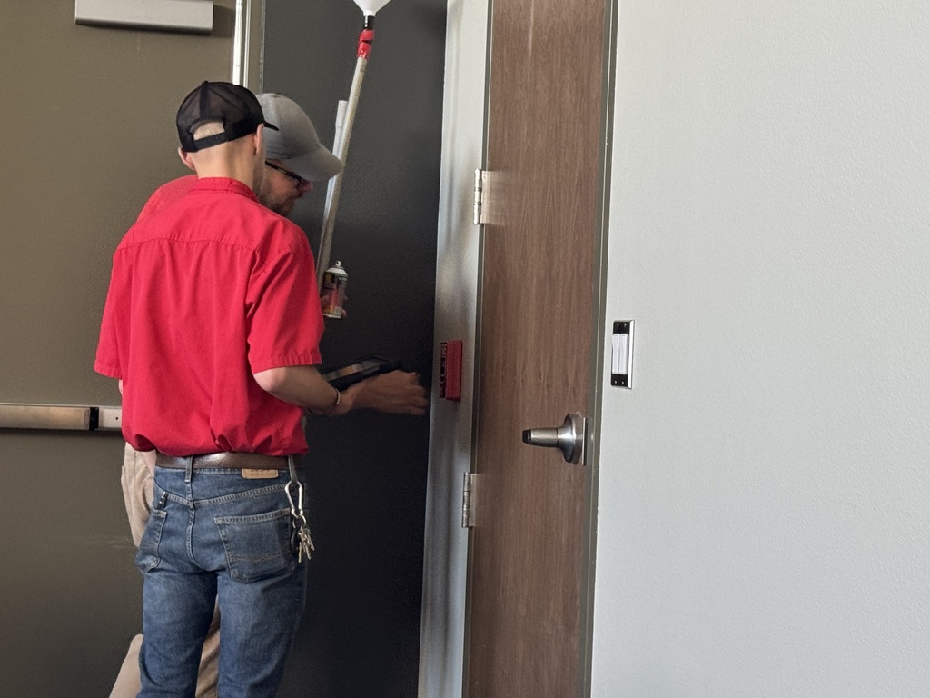 Testing a pull station fire alarm box.