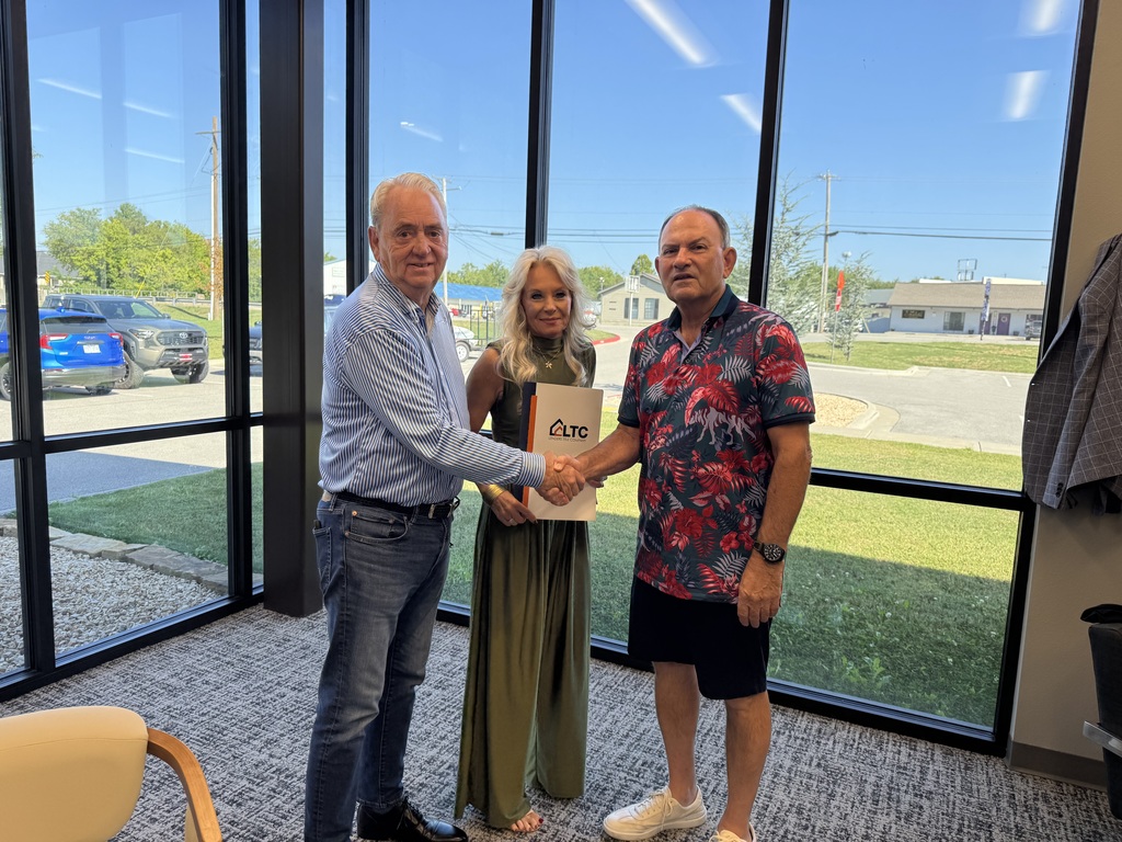 Mayor Jackson, Staci Avery and Steve Turner close the deal.