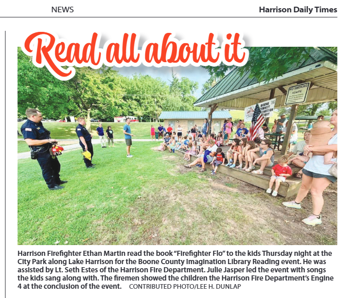 Firefighters reading at the park