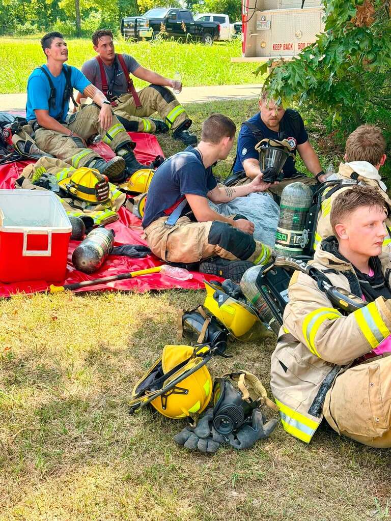 Fire fighters resting and rehydrating