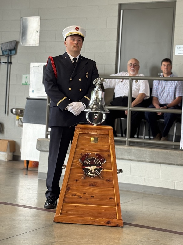 Capt Trevor Lowery rings bell