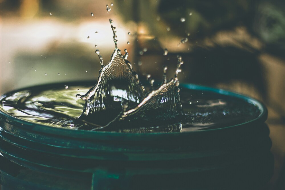 water splashing into barrel