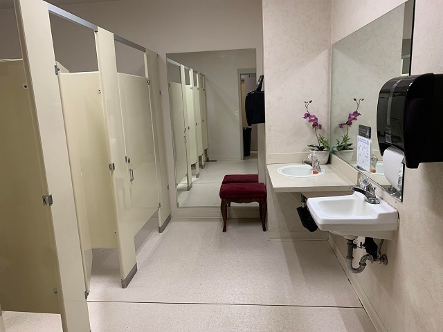 restroom with multiple stalls