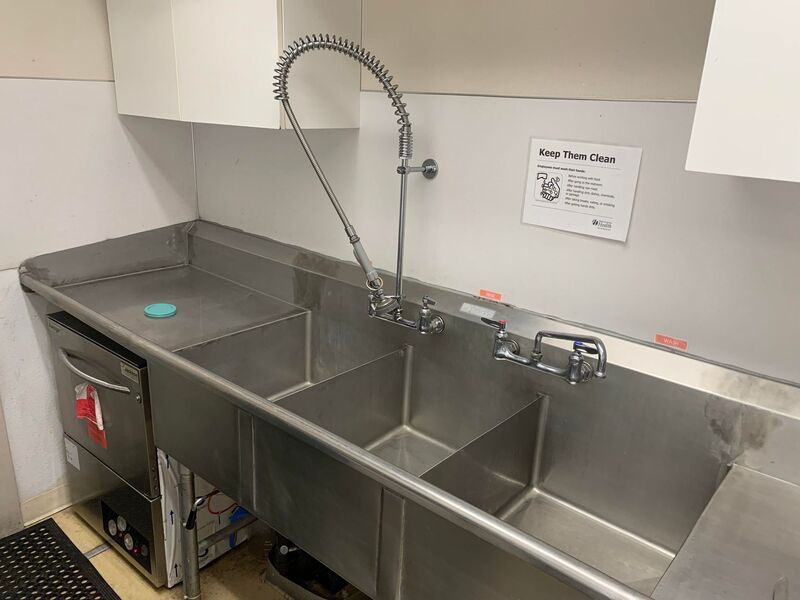 three basin sink & dishwasher in Kitchen