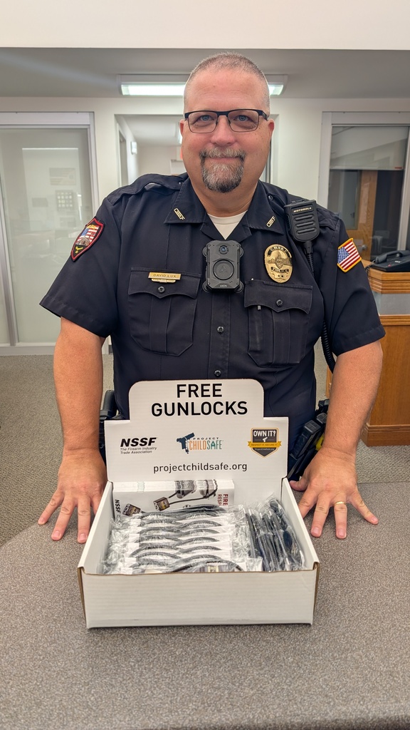 Chief David Lux showing a box of gun locks